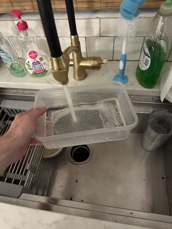 pouring water into a container