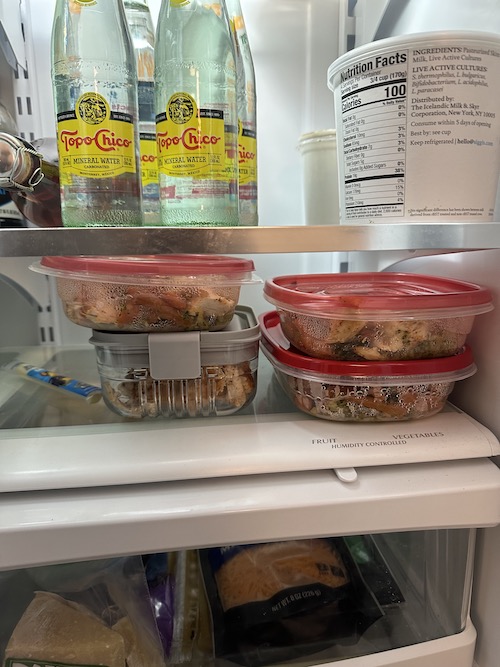 Tupperware stacked in fridge