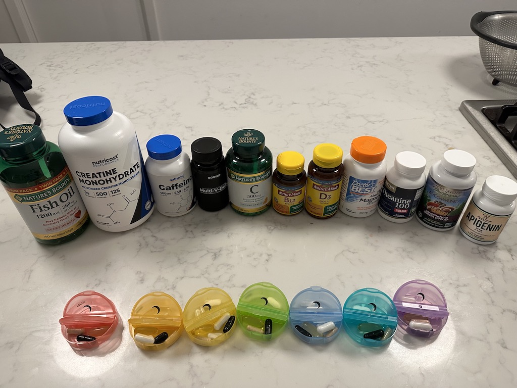 A lot of supplements sitting on a counter