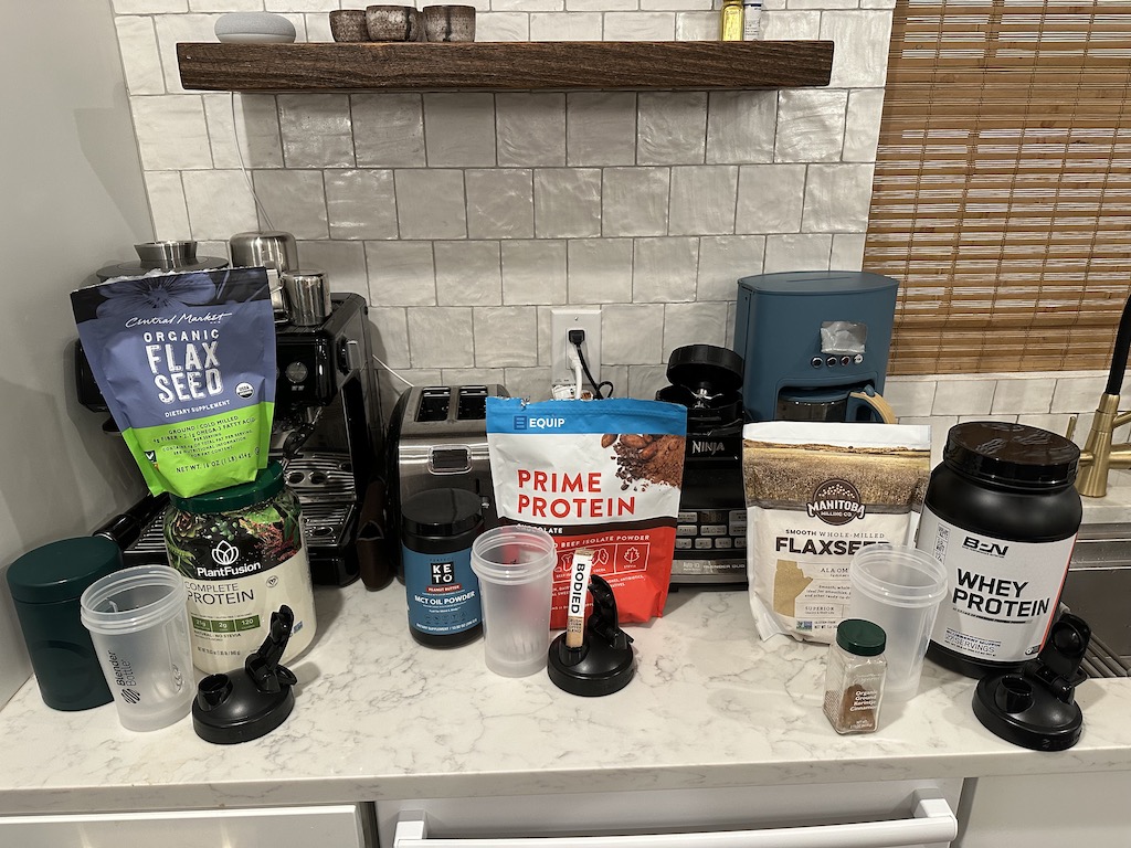 A lot of supplements sitting on a counter